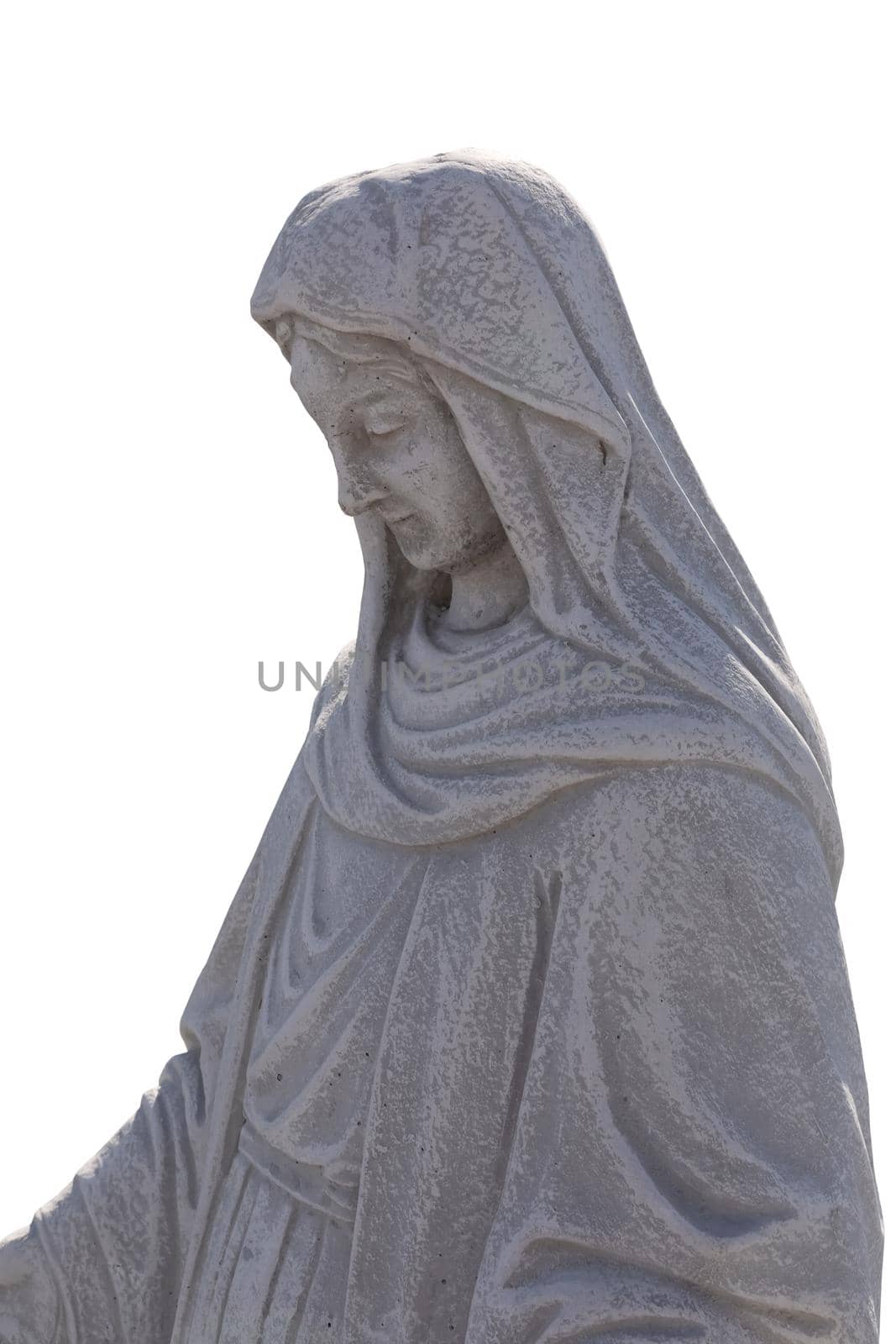 Close up side view of stone sculpture of virgin mary on white background by Wavebreakmedia