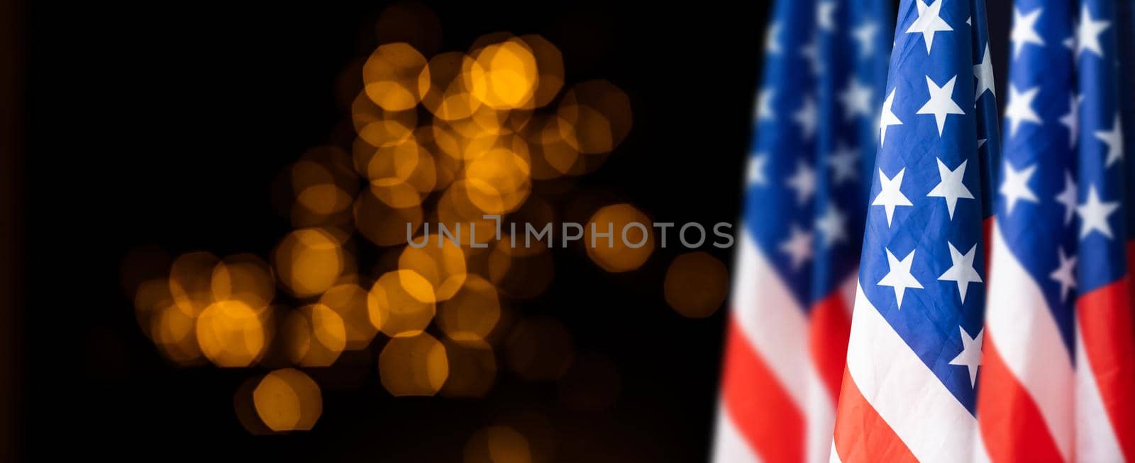 American flag on dark background.