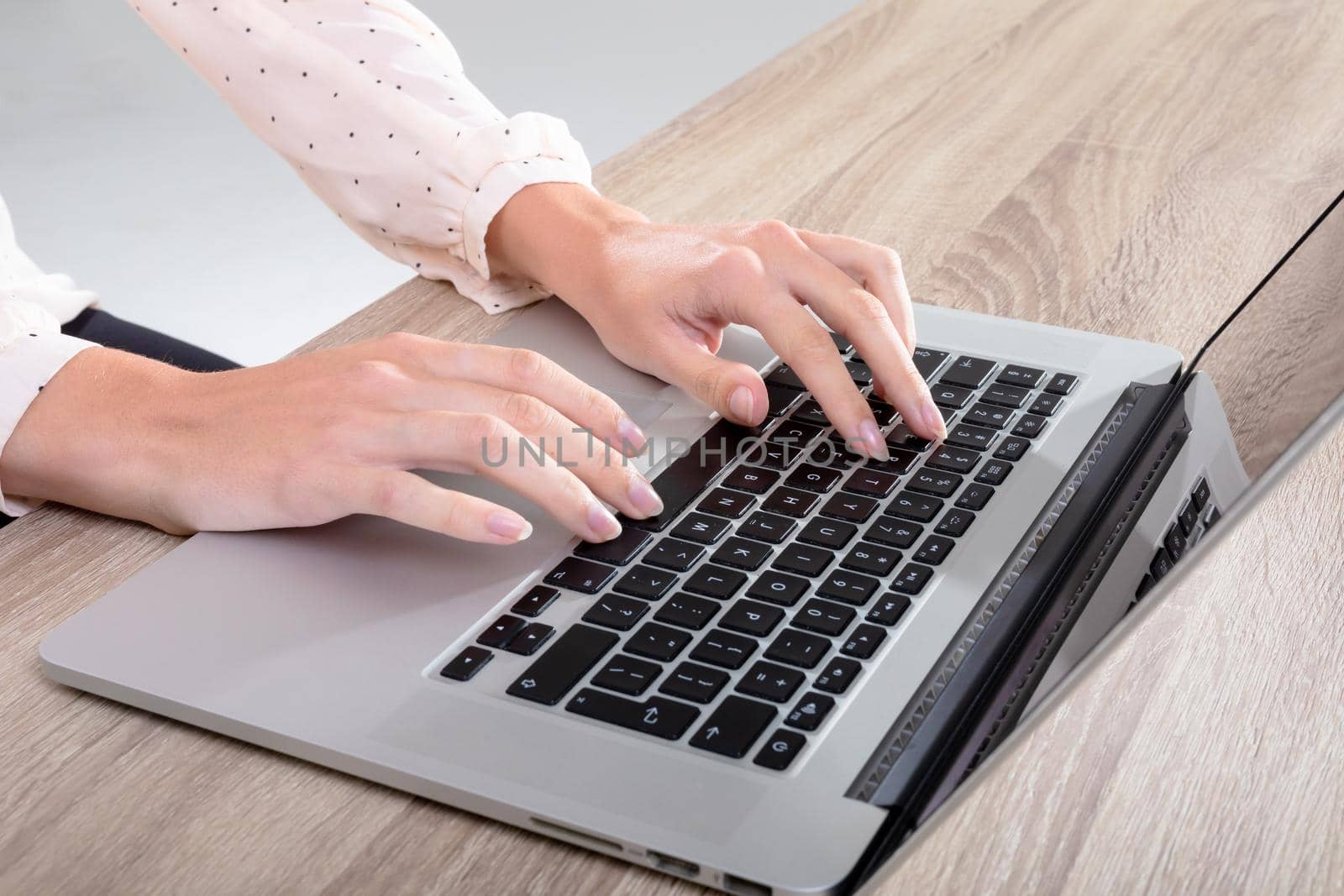 Midsection of caucasian businesswoman typing on keyboard, isolated on grey background. business, technology, communication and growth concept.