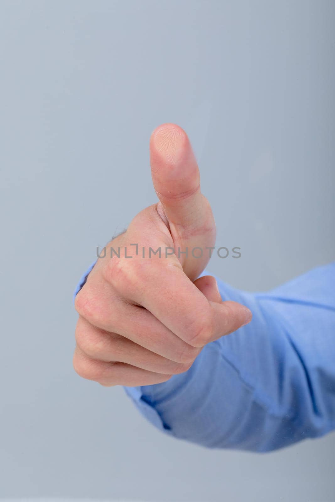 Midsection of caucasian businessman touching virtual interface, isolated on grey background by Wavebreakmedia
