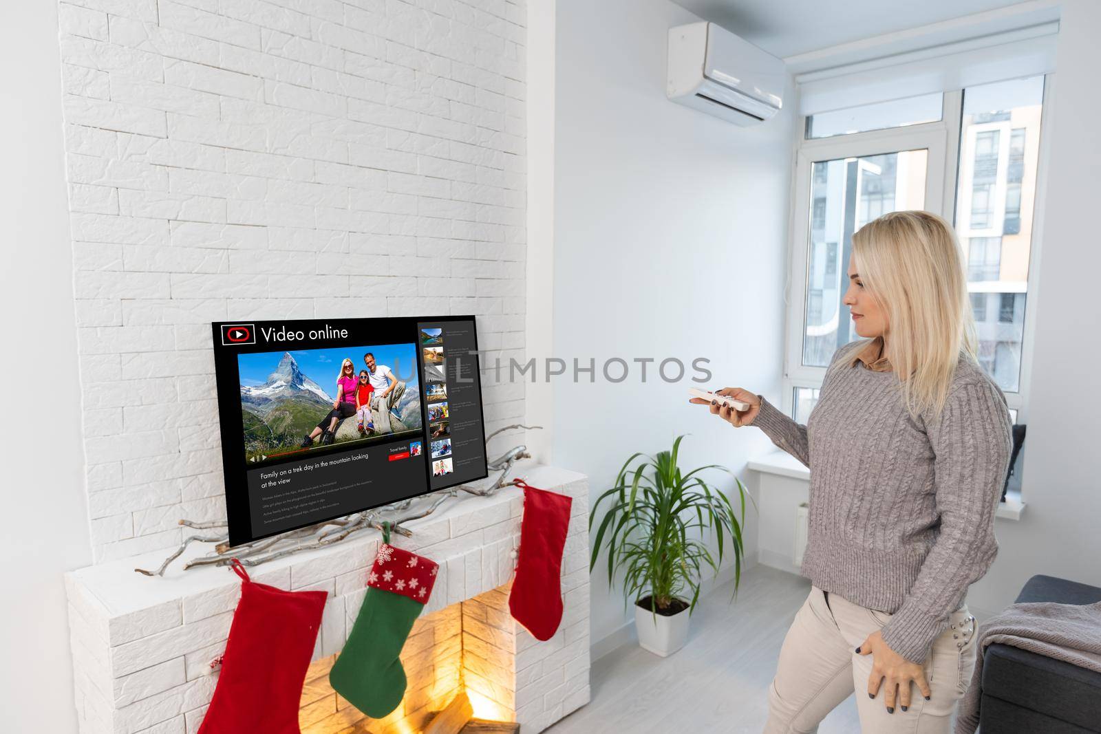 Happy woman watching TV, Christmas