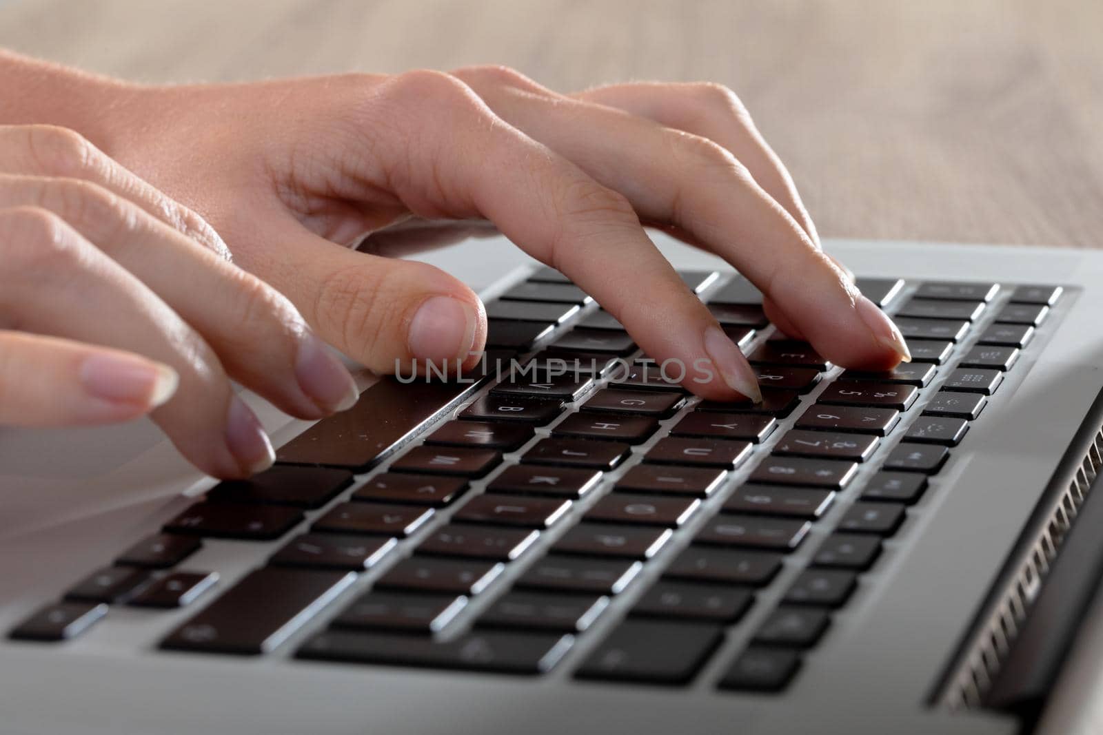 Close up of caucasian businesswoman typing on keyboard, isolated on grey background. business, technology, communication and growth concept.