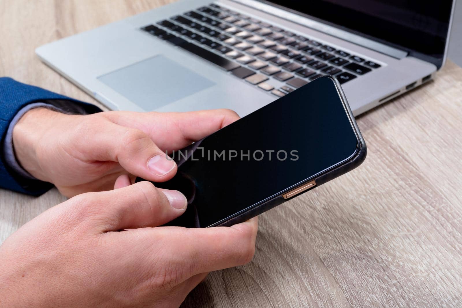 Midsection of caucasian businessman using smartphone and laptop, isolated on grey background. business technology, communication and growth concept digitally generated composite image.