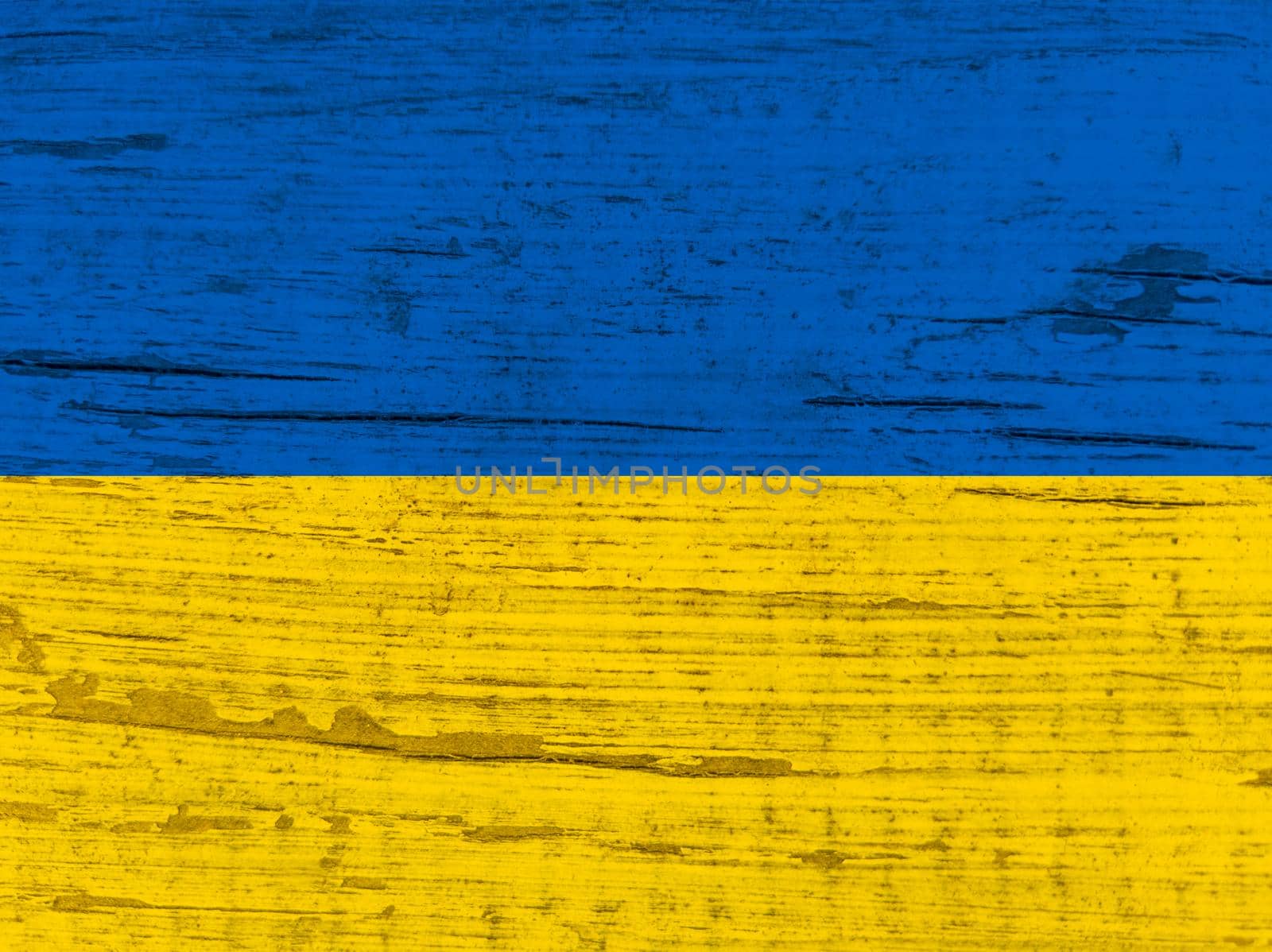 Ukrainian flag painted. Wrinkled blue and yellow colored grungy background