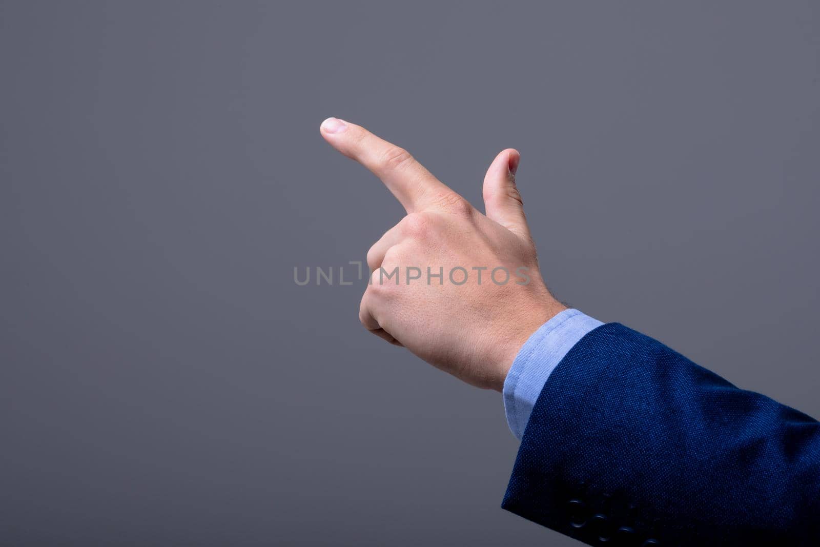 Midsection of caucasian businessman touching virtual interface, isolated on grey background. business technology, communication and growth concept.