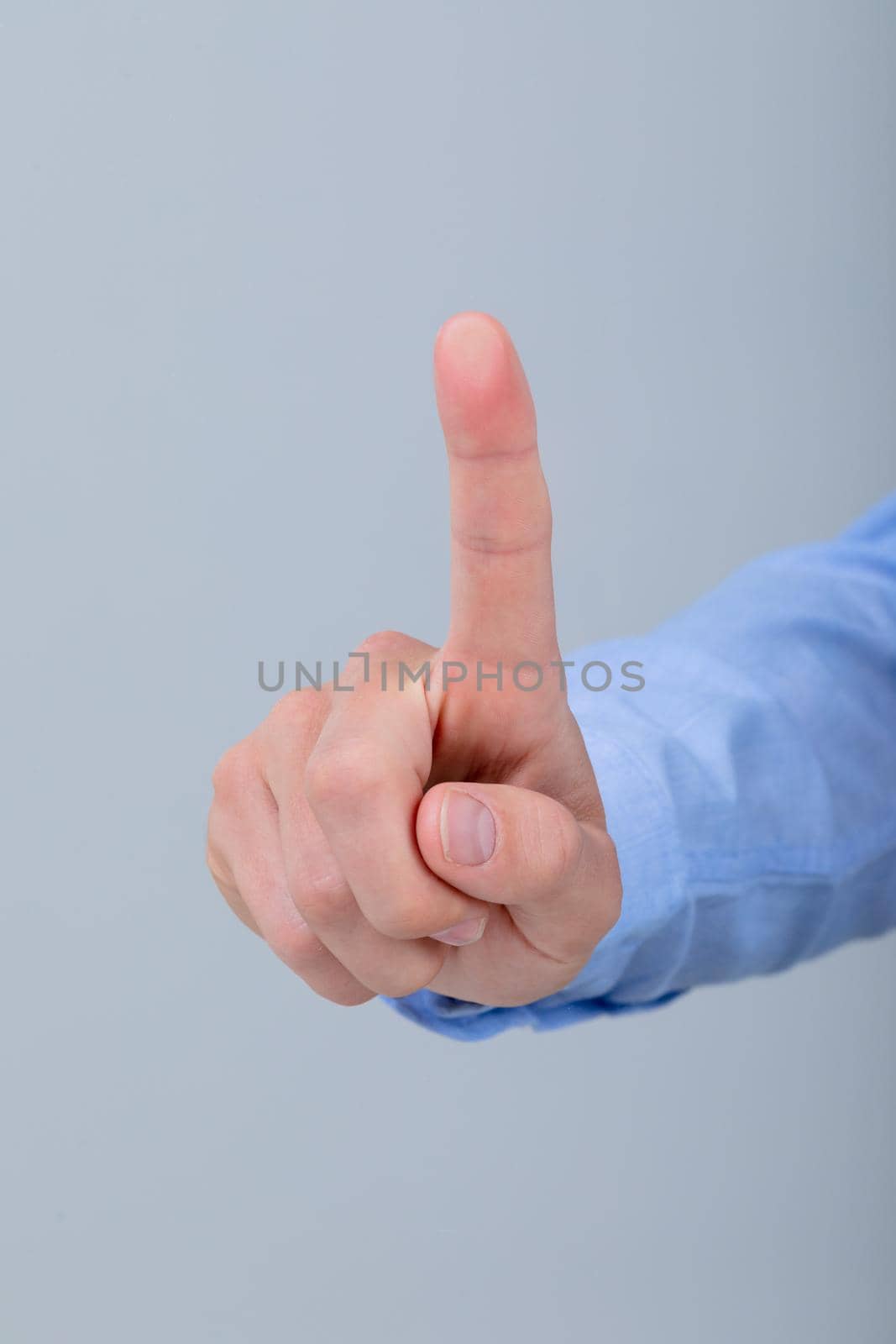 Midsection of caucasian businessman touching virtual interface, isolated on grey background. business technology, communication and growth concept.