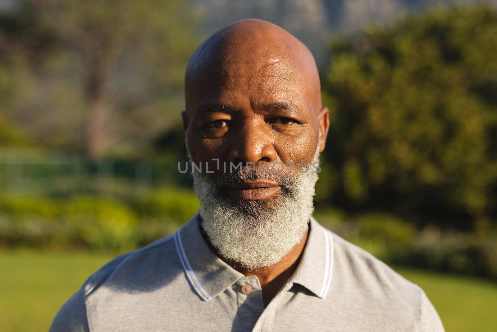 Portrait of smiling senior african american man in stunning countryside by Wavebreakmedia