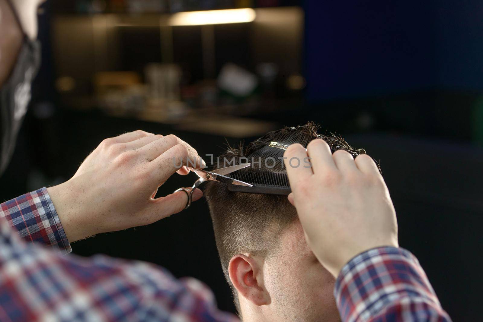 Close-up of hairdresser male hands during cutting male hair by Ashtray25