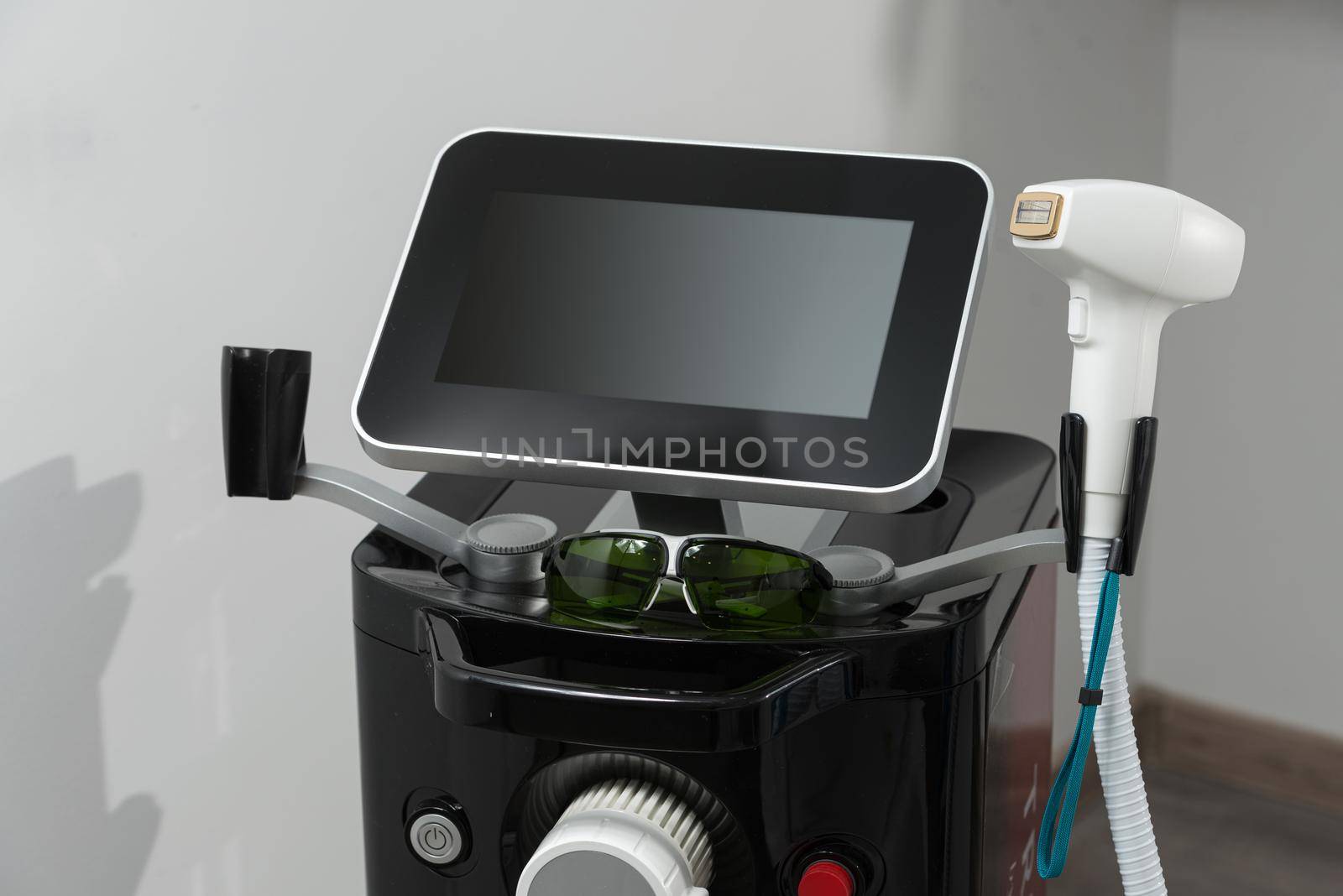 Modern equipment for laser hair removal in a beauty salon. Beauty salon and cosmetology by Ashtray25