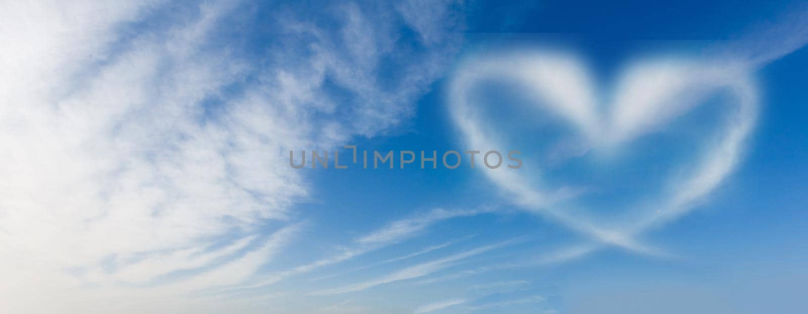 blue sky with hearts shape clouds. Beauty natural background by Andelov13