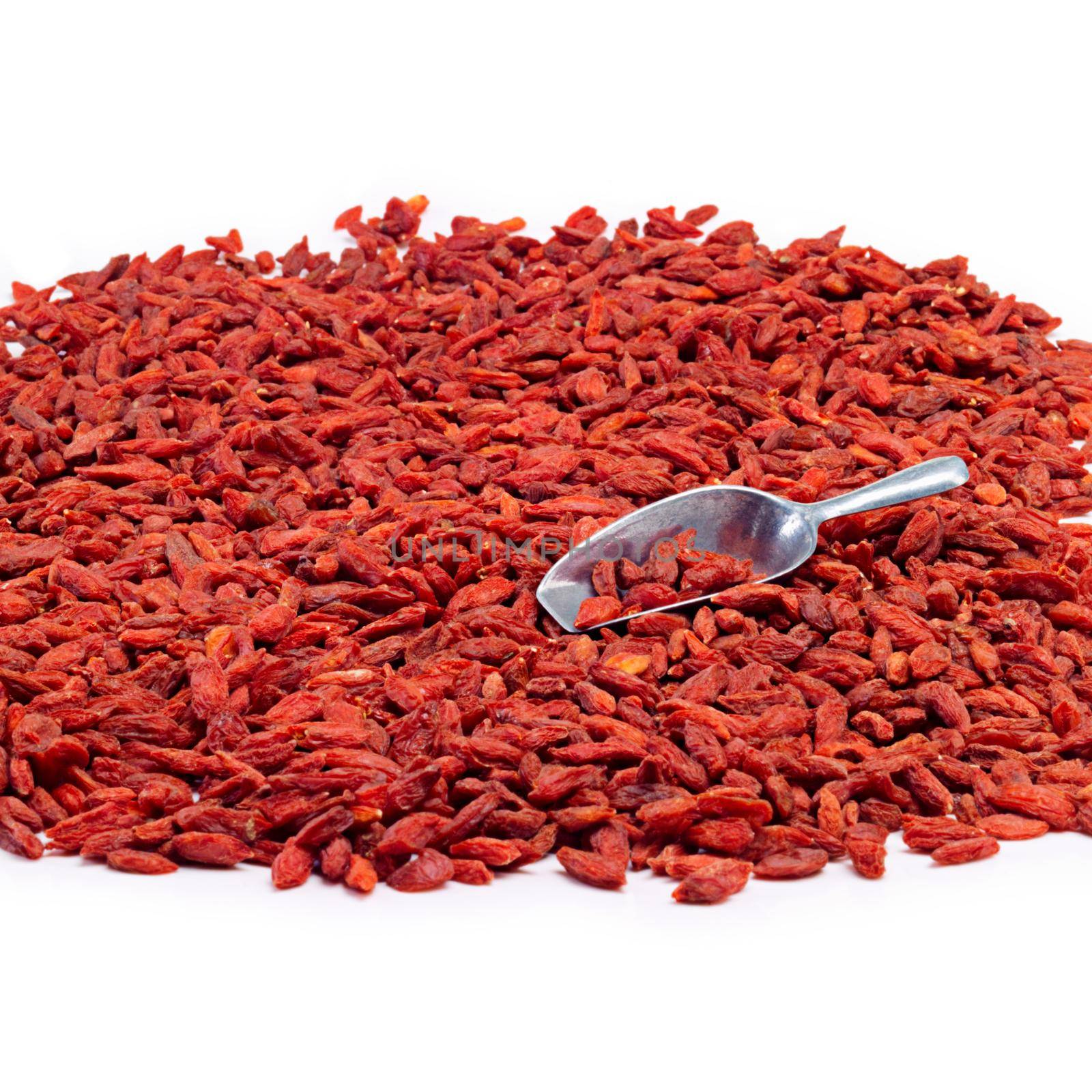 Get some goji power. Studio shot of a pile of goji berries with a metal scoop. by YuriArcurs