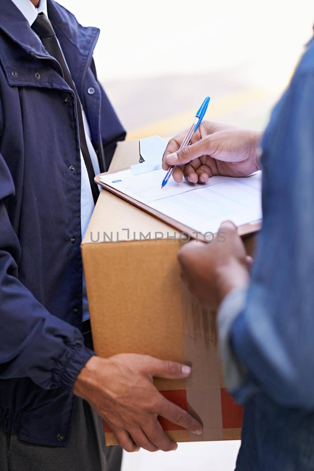 Delivering direct to your door. A friendly delivery man delivering a package to a home. by YuriArcurs