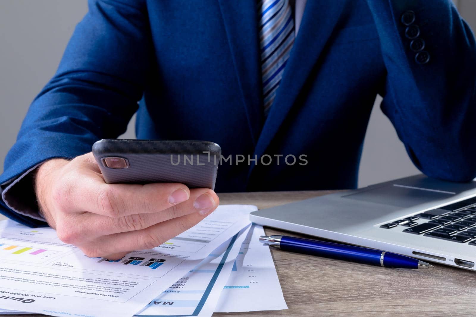 Midsection of caucasian businessman using smartphone, isolated on grey background. business technology, communication and growth concept digitally generated composite image.