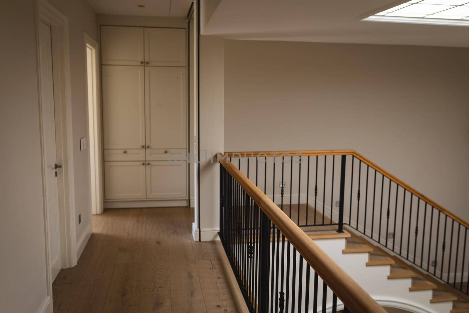 General view of house interior with spacious hallway and staircase. modern interiors and house decoration concept.