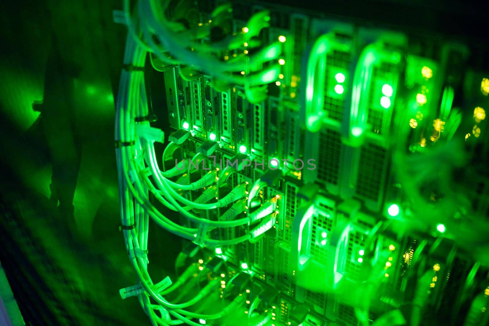 Closeup of computer server with colorful lights and wires by Wavebreakmedia