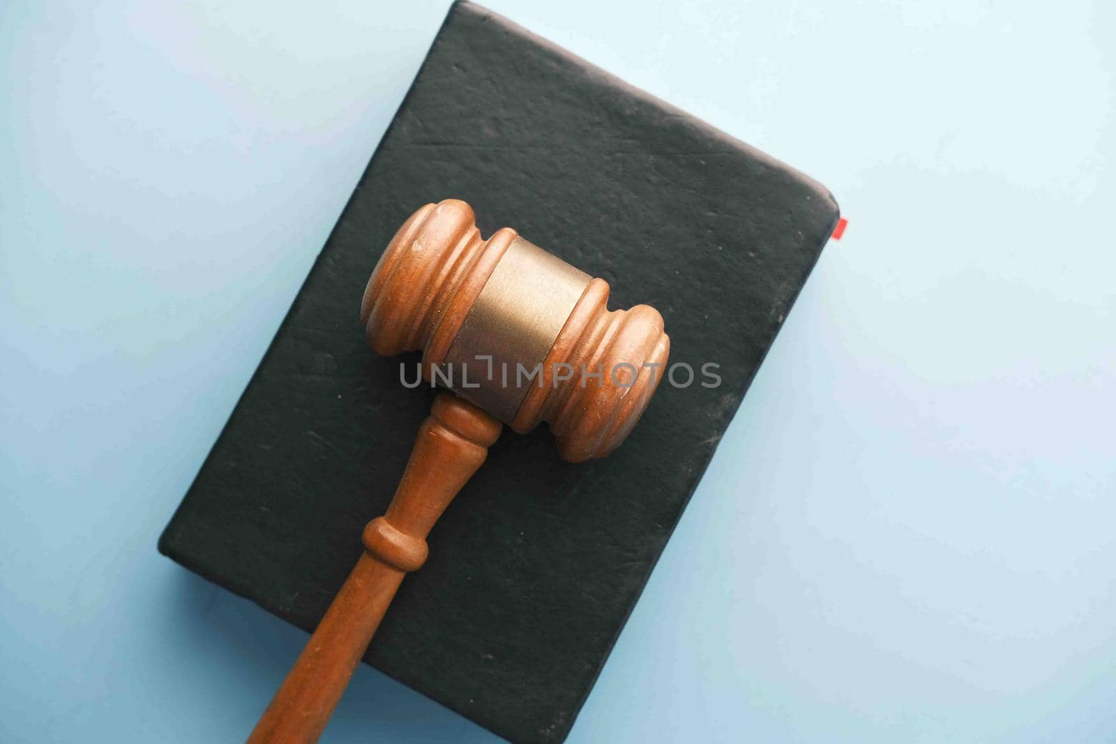Top view of gavel and book with copy space on table .