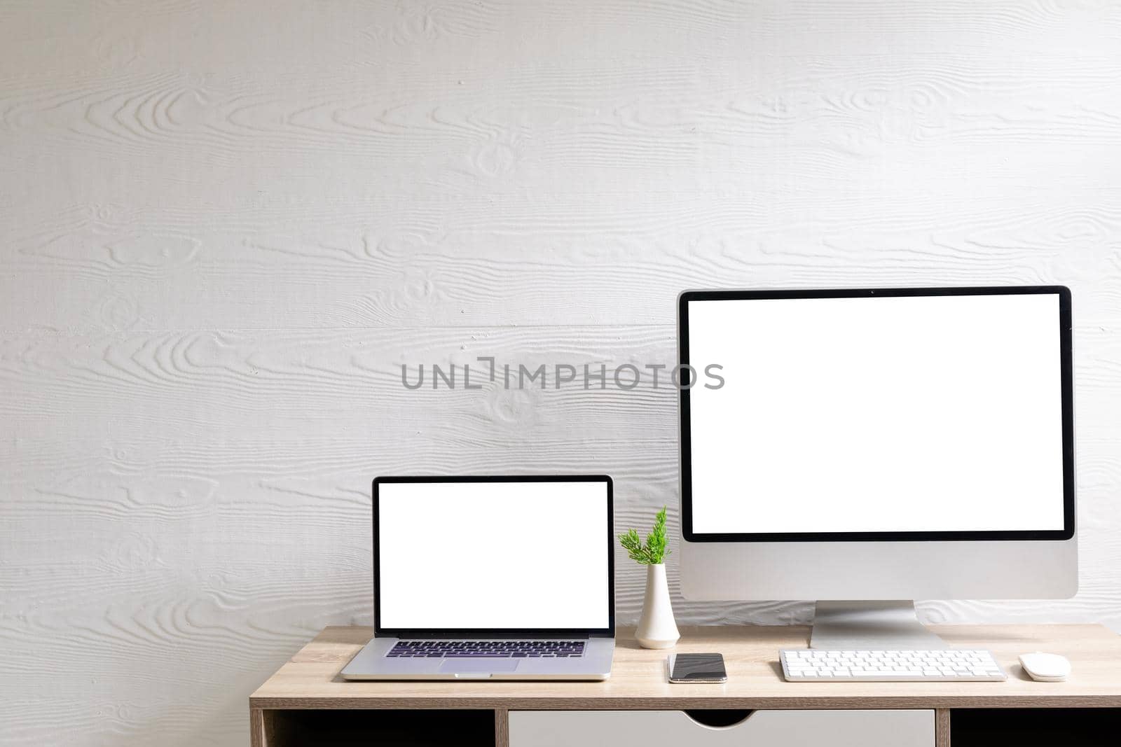 Composition of desktop computer and laptop with copy space on white background. modern office communication and technology concept.