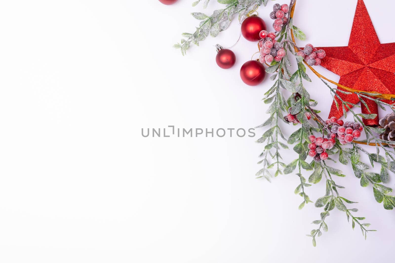 Composition of christmas decorations with baubles, branches and copy space on white background. christmas, tradition and celebration concept.