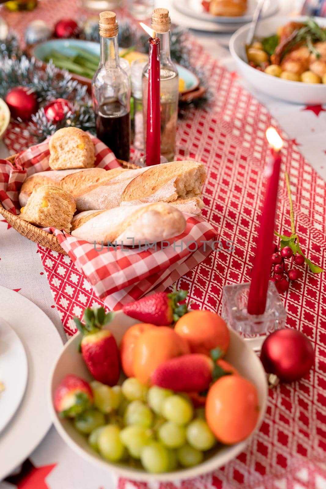 Diverse dishes, candles and christmas decorations lying on table by Wavebreakmedia