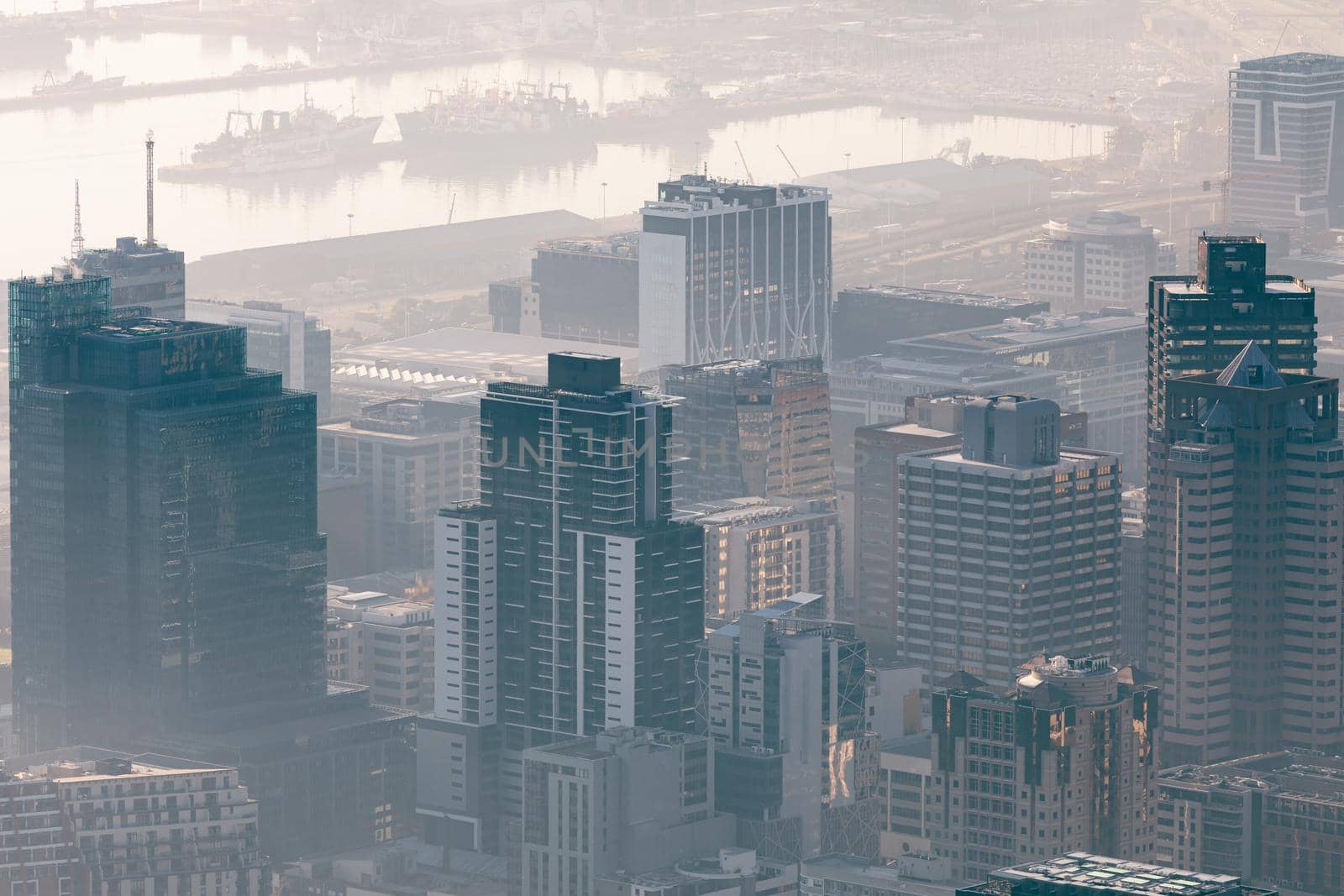 General view of cityscape with multiple modern buildings and skyscrapers in the foggy morning. skyline and urban architecture.