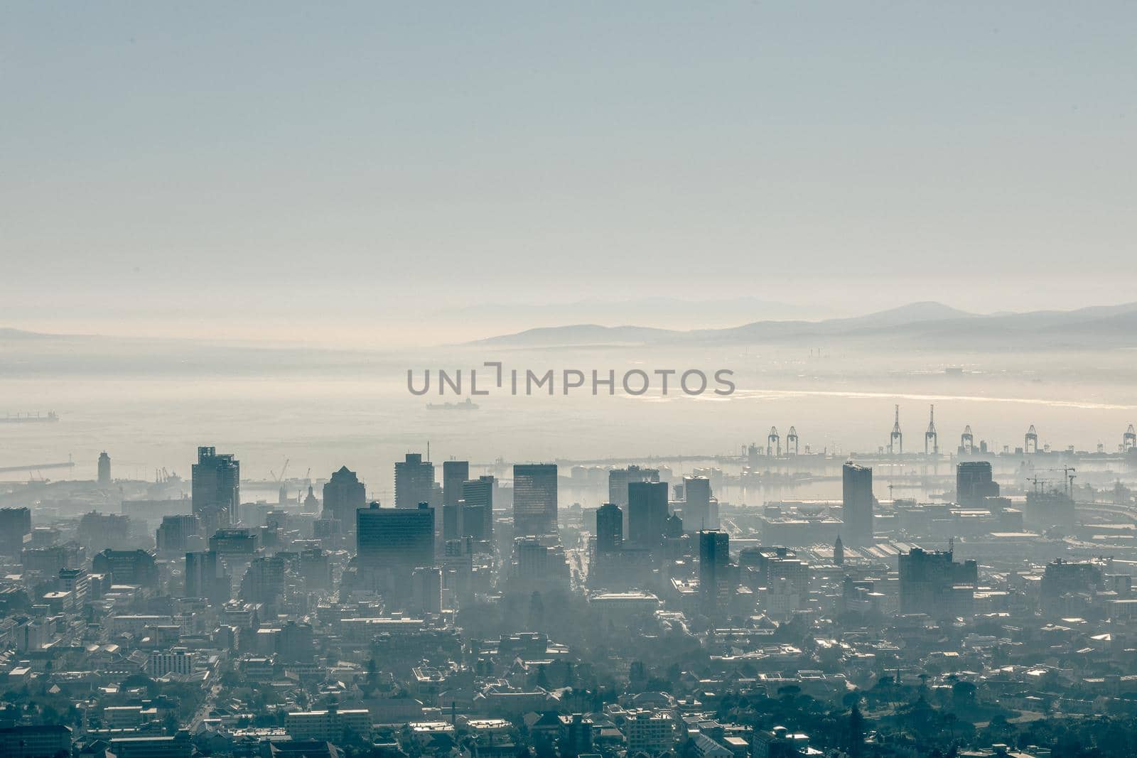 General view of cityscape with multiple modern buildings and skyscrapers in the foggy morning. skyline and urban architecture.