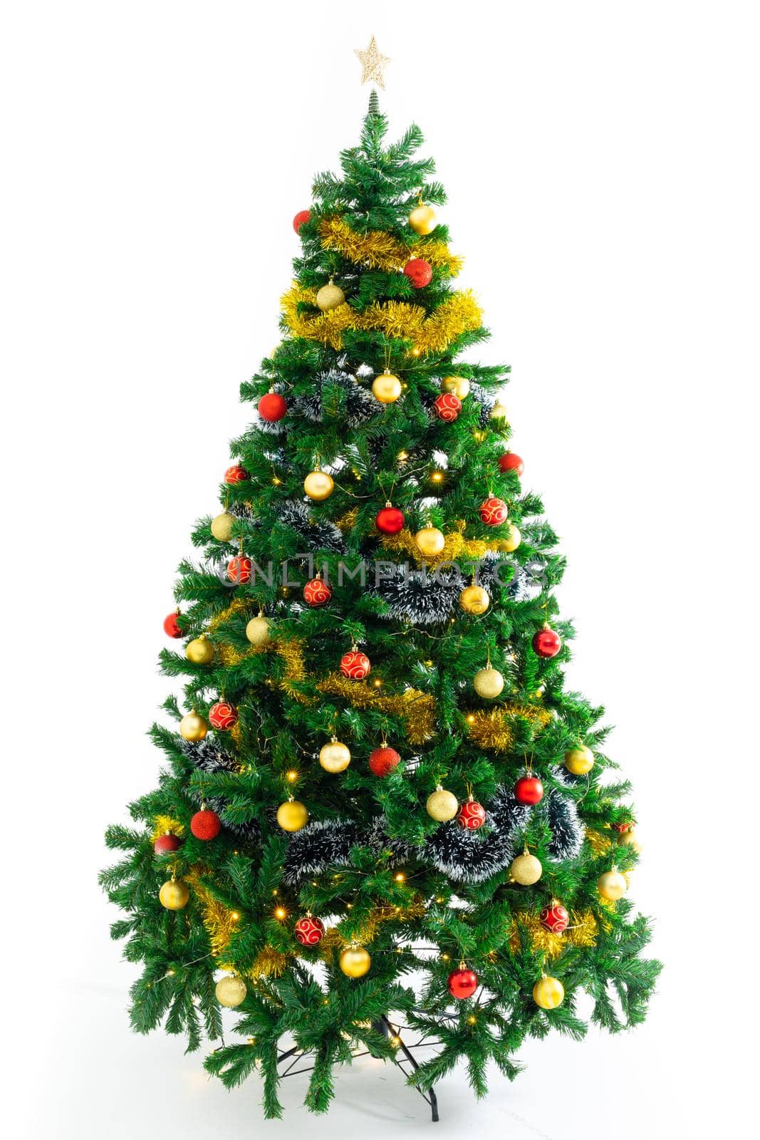 Composition of christmas tree with baubles and star decorations on white background by Wavebreakmedia