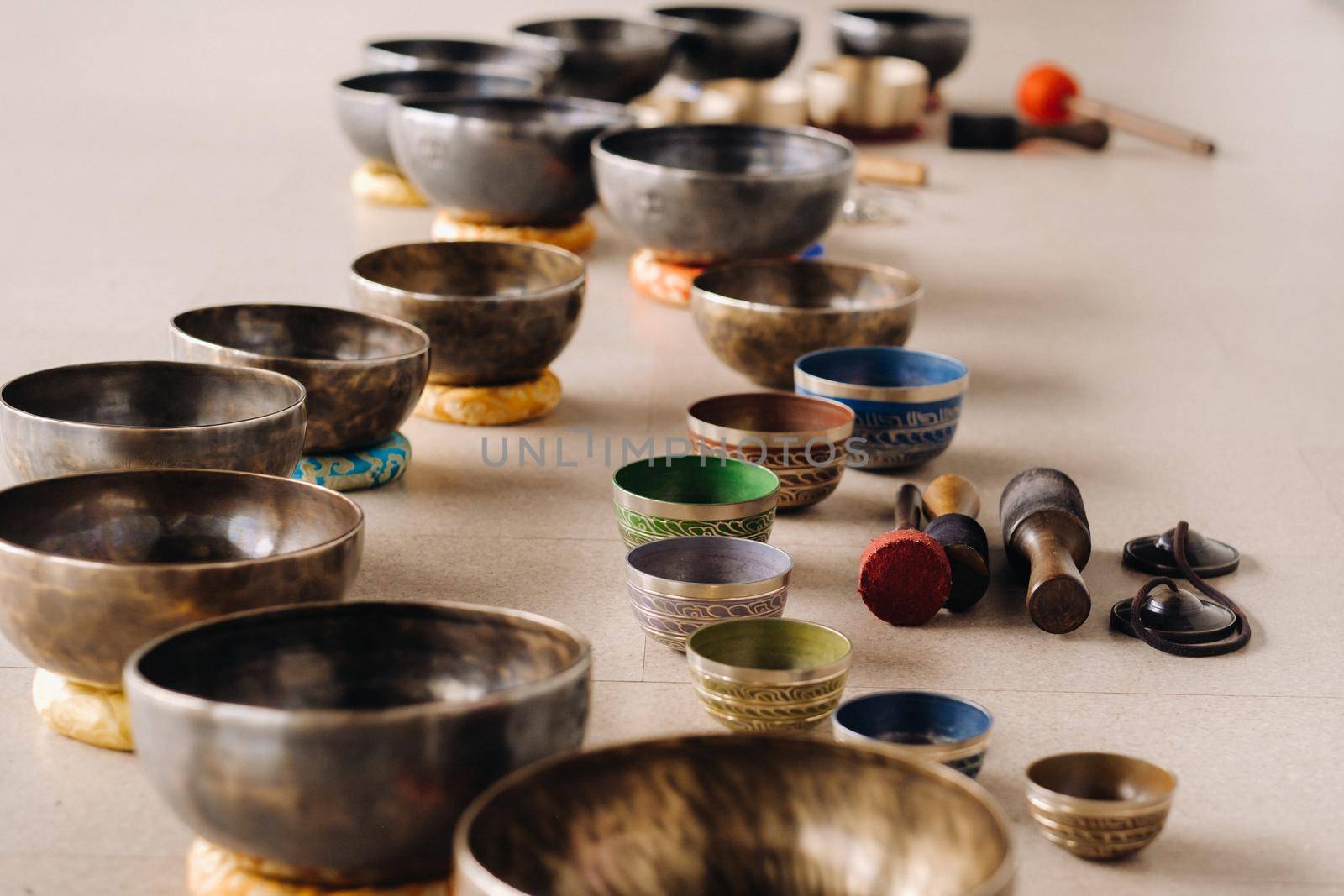 A close-up of a Tibetan singing bowl - Translation of mantras: Transform your impure body, speech and mind into a pure exalted body, speech and mind of a Buddha.