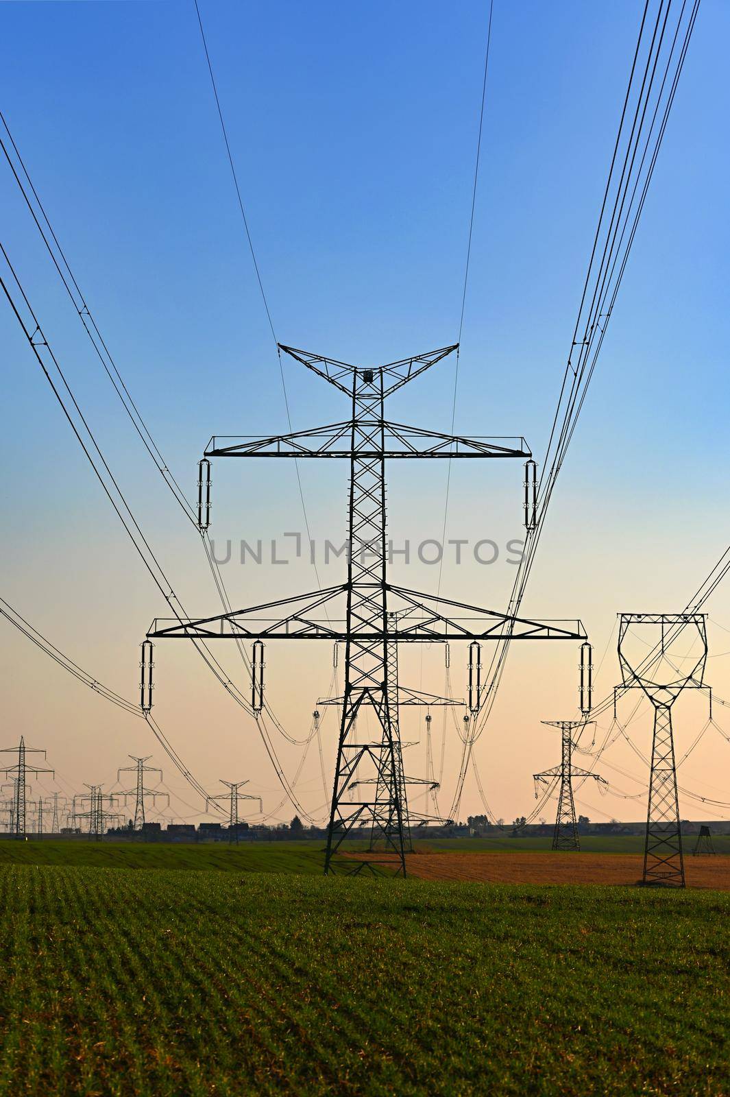 High voltage pylons. Concept for technology and industry. Rising energy prices - further rising electricity and energy prices - the energy crisis caused by the war between Russia and Ukraine. by Montypeter