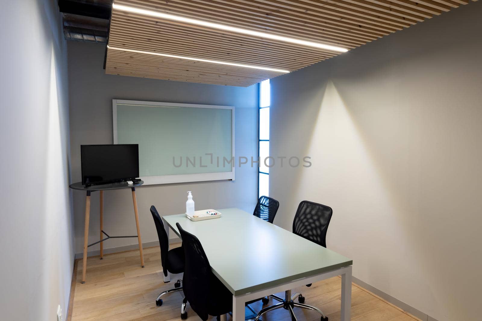 Empty conference room with copy space on screens at office. business, meeting and office workplace.