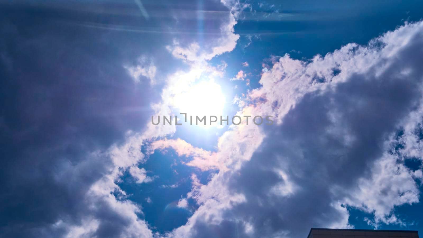 beautiful sun shines from behind the clouds. color by lempro