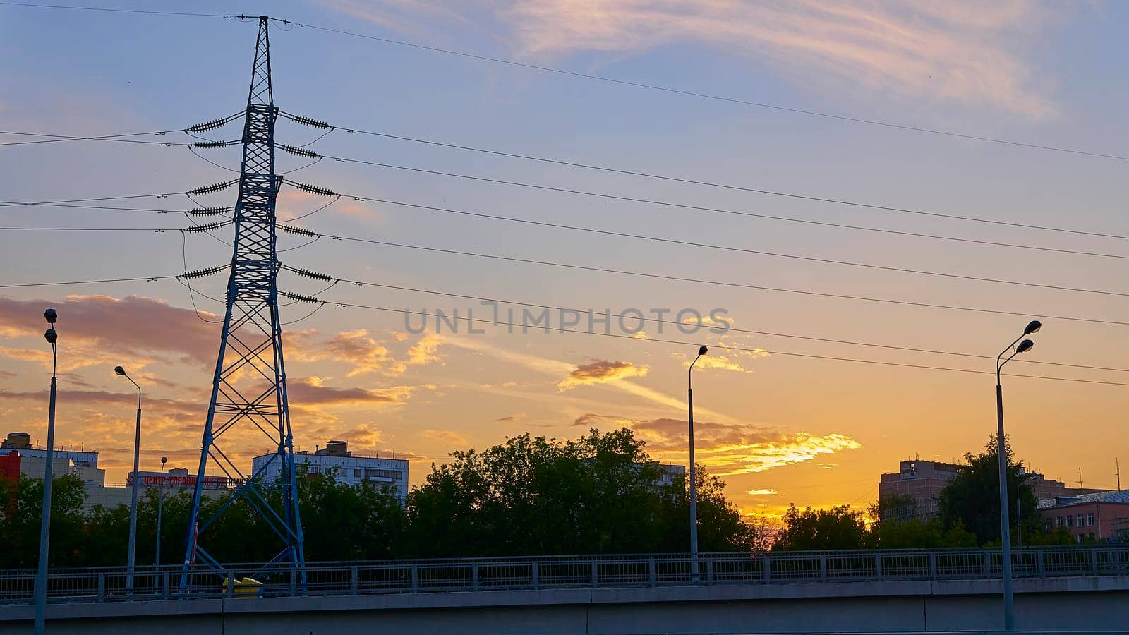 beautiful sunset against the backdrop of the power transmission line