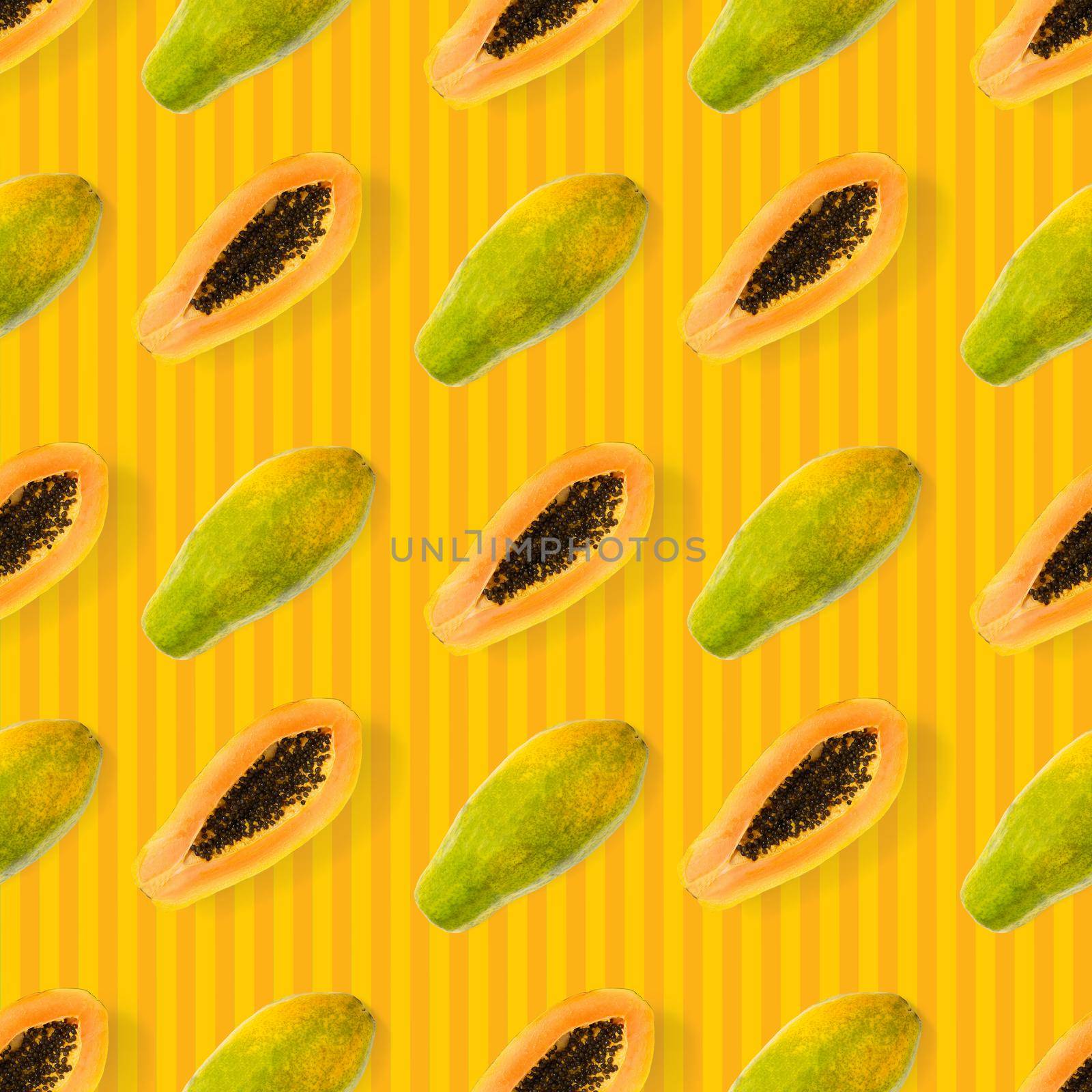 Fresh ripe papaya seamless pattern on orange background. Tropical abstract background. Top view. Creative design, minimal flat lay concept. Trend tropical fruit food background pattern