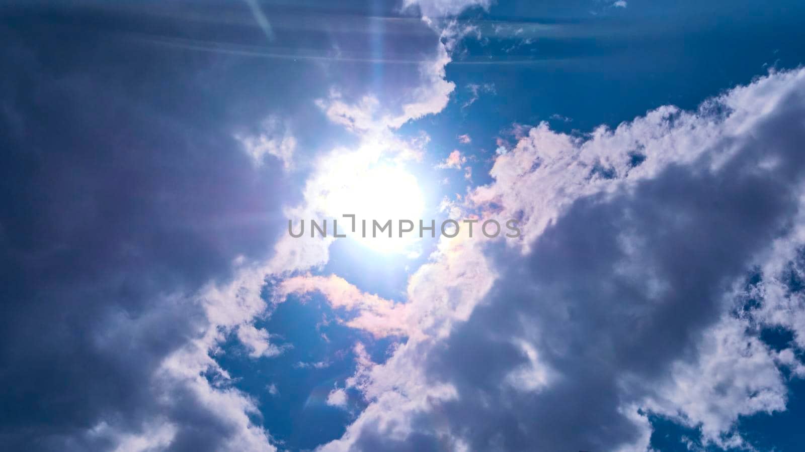 beautiful sun shines from behind the clouds. color by lempro