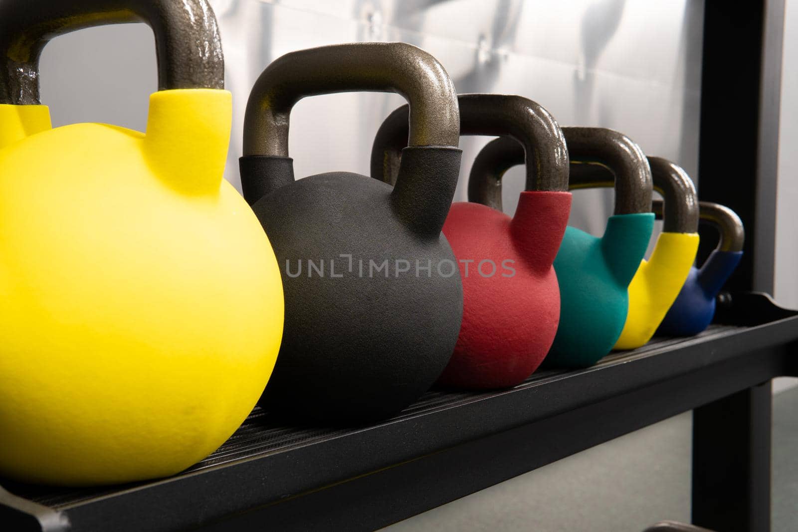 Yellow kettlebell weight isolated white, in the afternoon fitness equipment in lifestyle and assorted colours, shape tough. Pace colorful club, competition dumbbell black fresh black background object