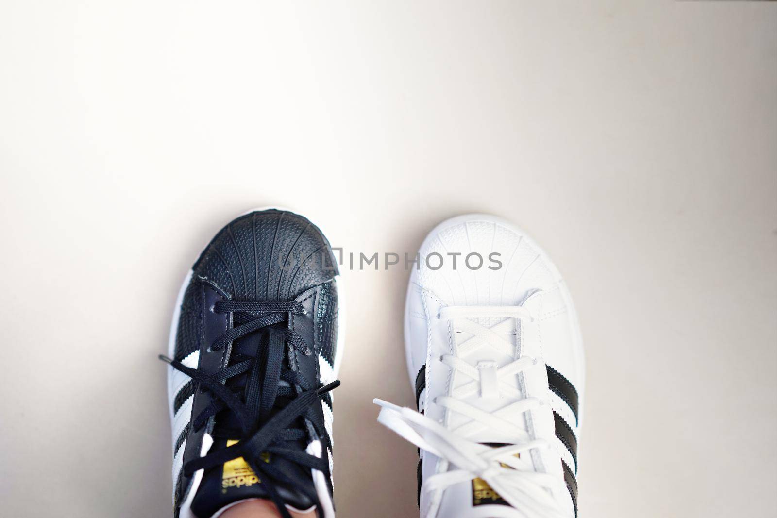 Bangkok,Thailand,July 18,2018-Pairs of black and white color sneaker adidas shoes by VacharapongW