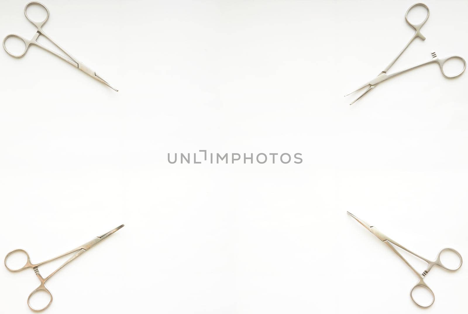 cramp forceps on corner of white copy space by VacharapongW