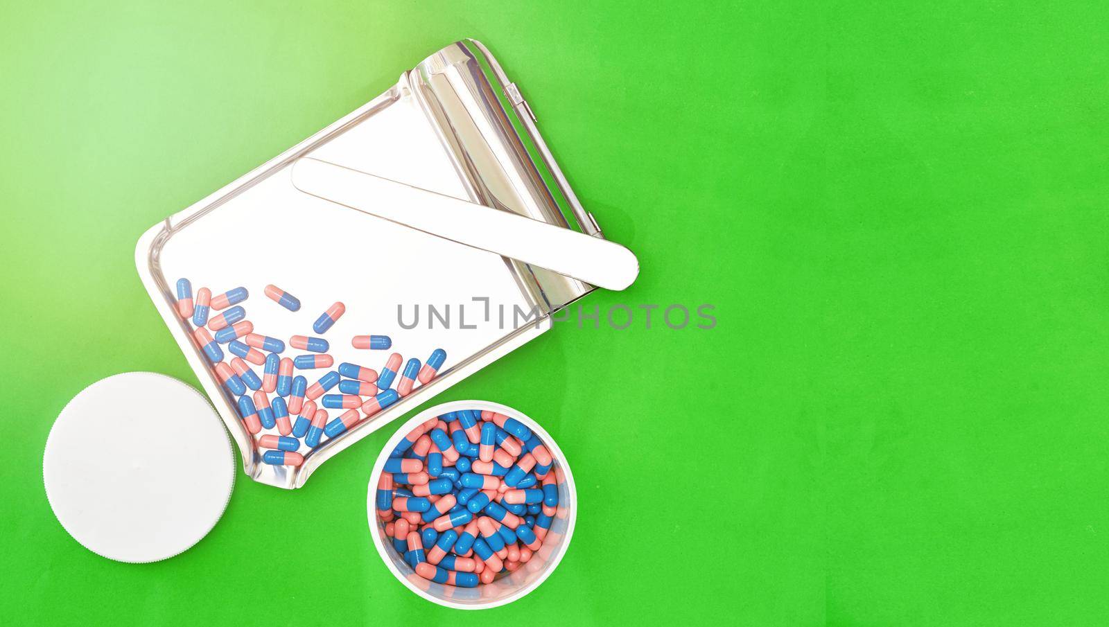 capsules on tray and bottle top view