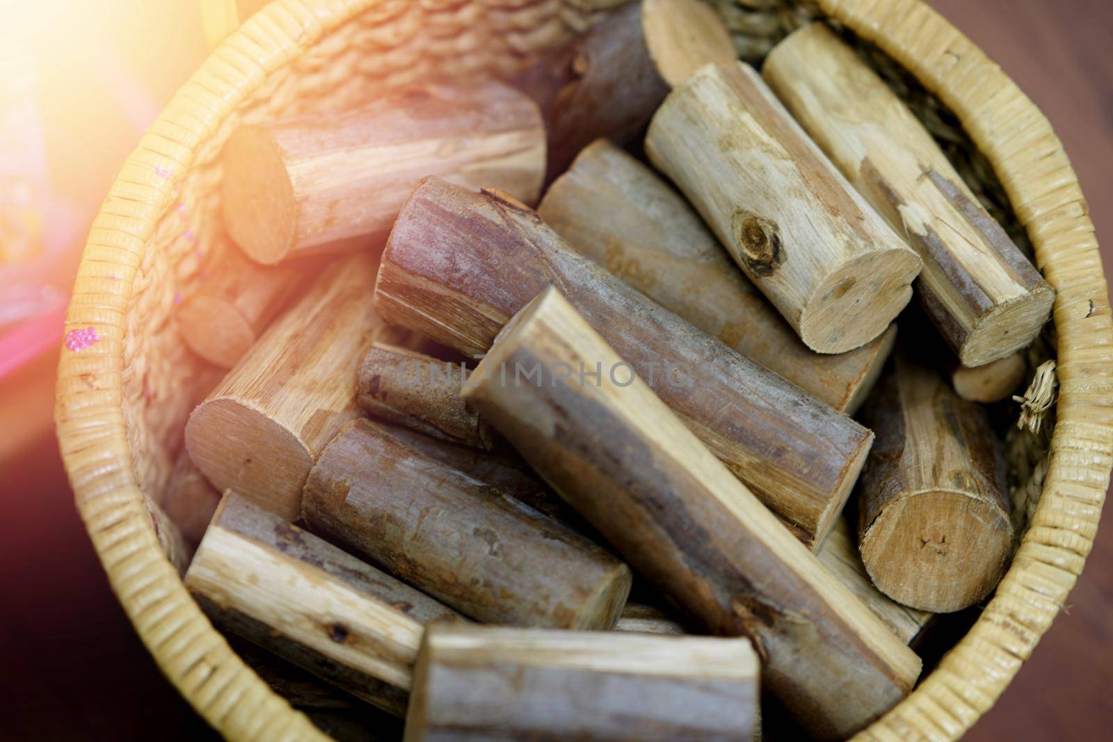 wood for fire in basket with sun