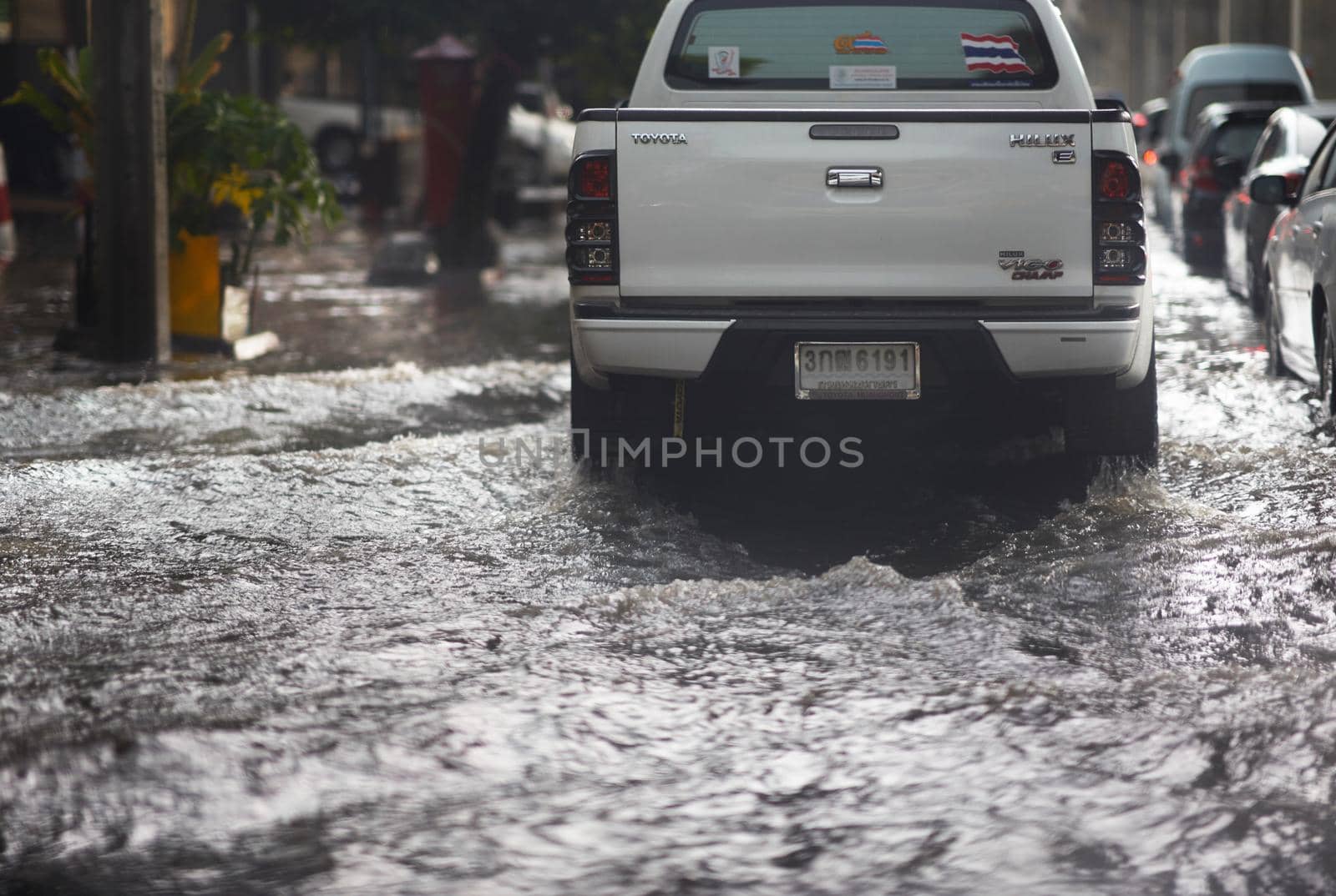 Bangkok ,Thailand ,May 16 ,2019-Flood on public road and mimitruck in traffic view