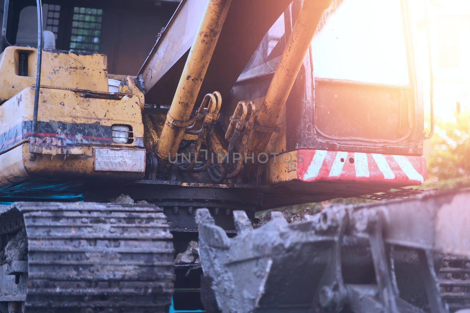 excavator with bucket with sun