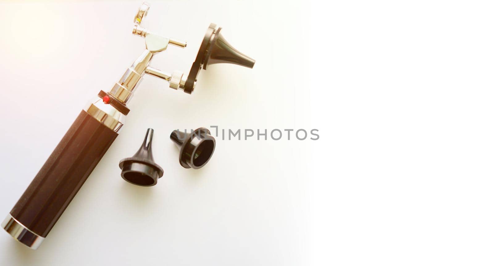 Otoscope for ear check for doctor ENT  with three sizes of specula pieces on blur background with copy space,selective focus