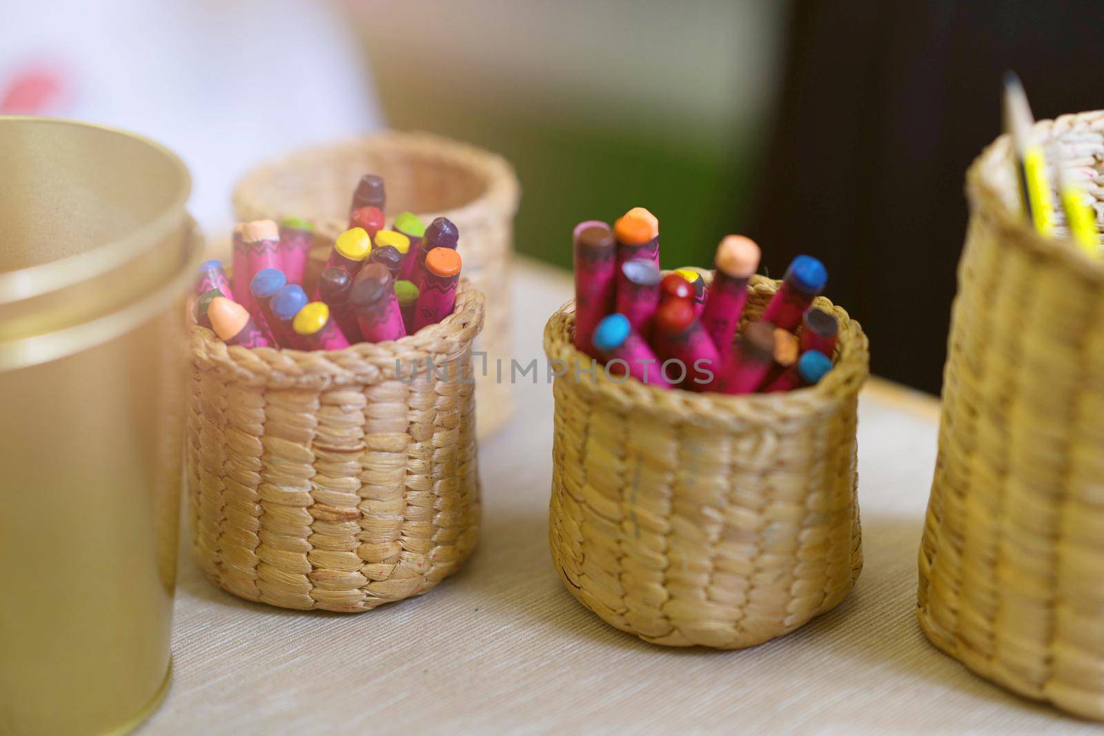crayons in container for art with sun
