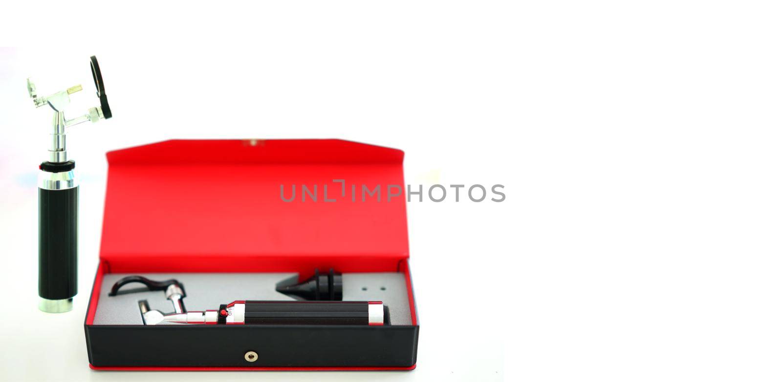 Otoscope for ear check for doctor ENT in block box on blur background