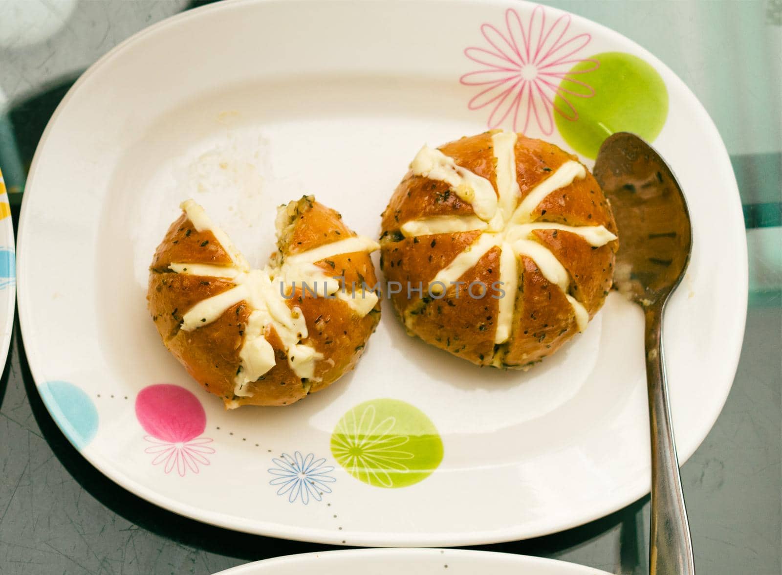 round baked bread with butter inside
