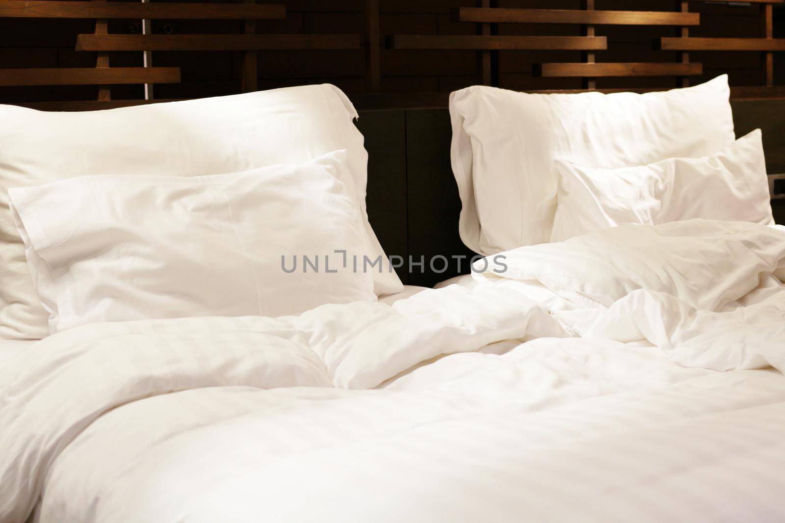 mess bed sheet in hotel room in relaxation room for customer concept