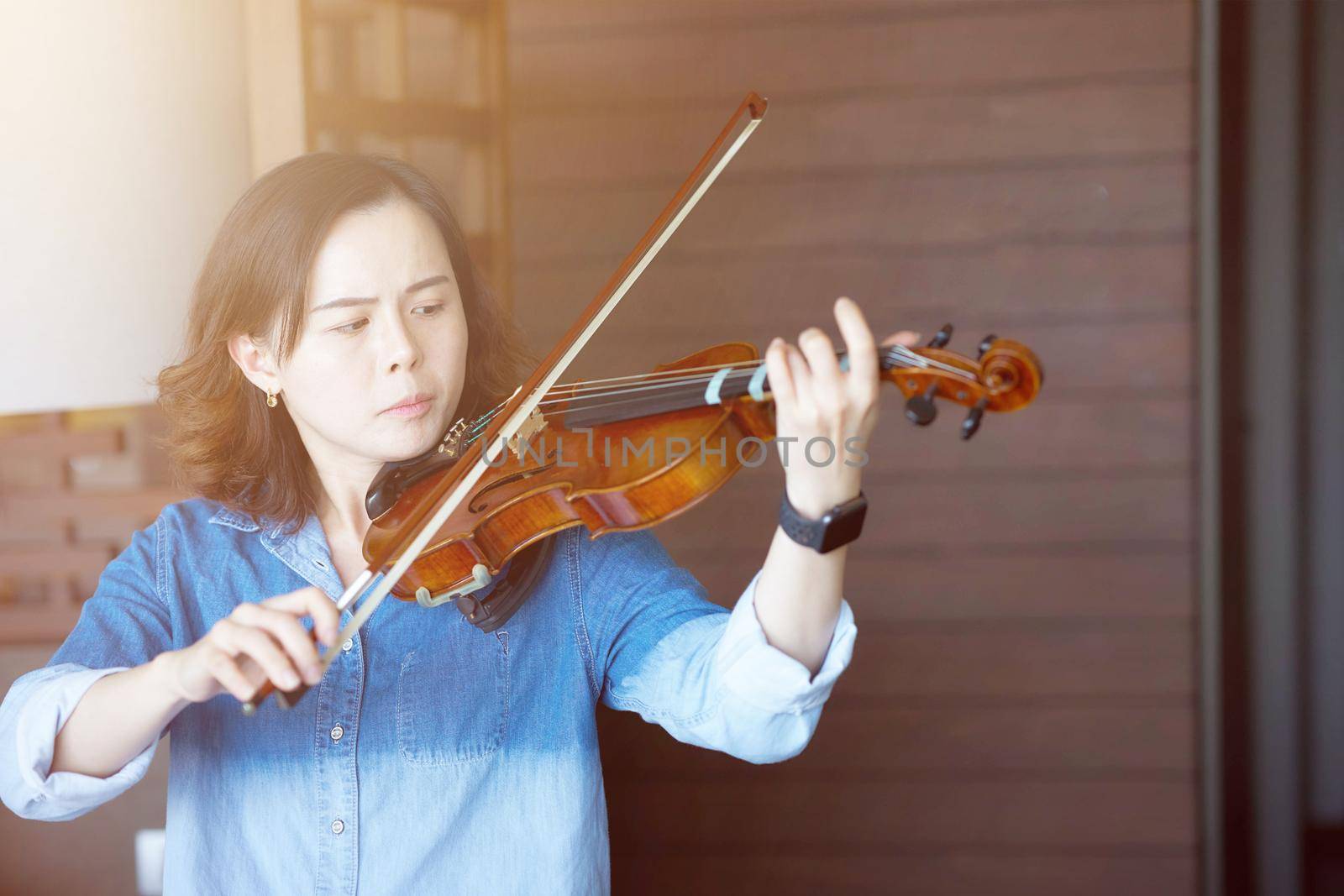 asian woman practice violin casual