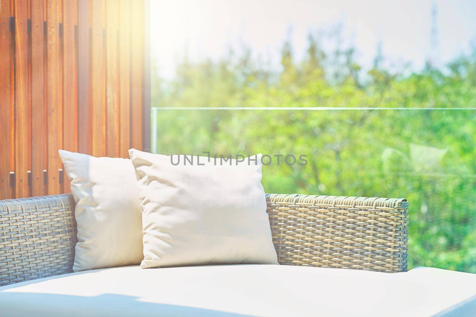sofa with pillows in sunlight ,outdoors