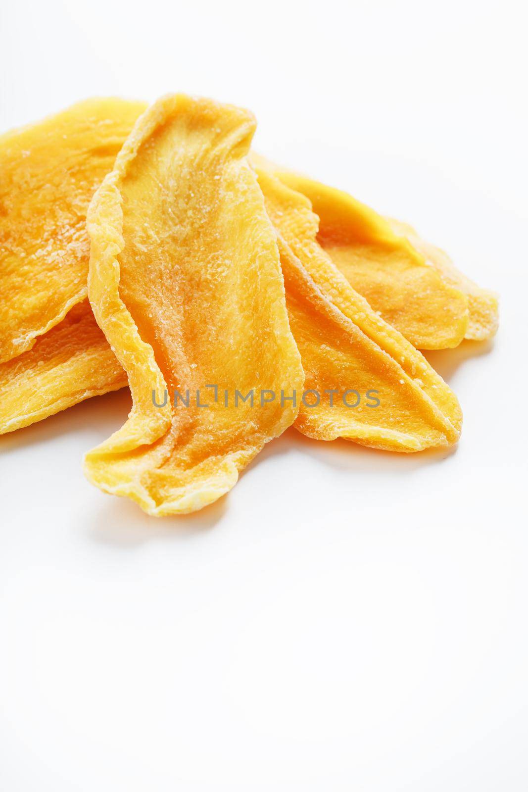 Orange Slices of Dried Sugar Mango Isolated by AlexGrec