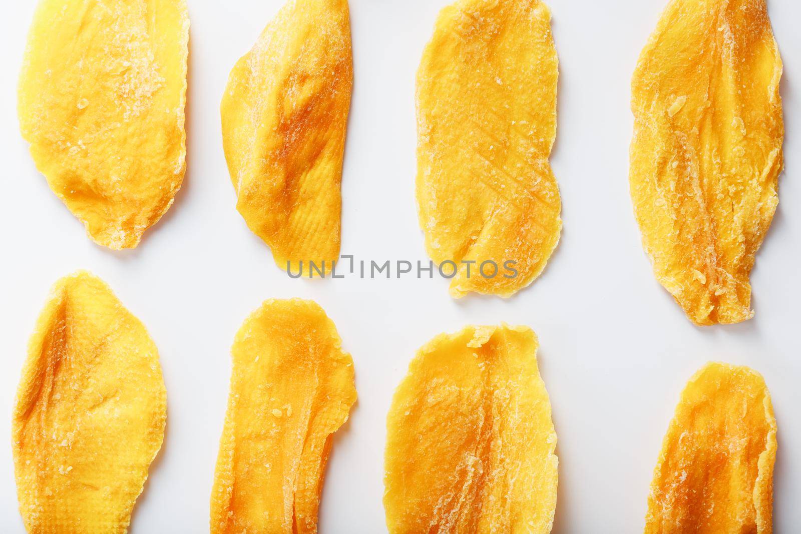 Orange Slices of Dried Sugar Mango Isolated on White Background