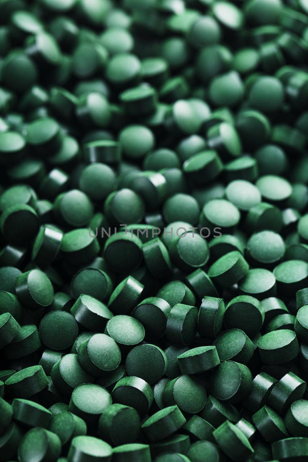Green tablets from spirulina vegetarian dietary supplement by AlexGrec